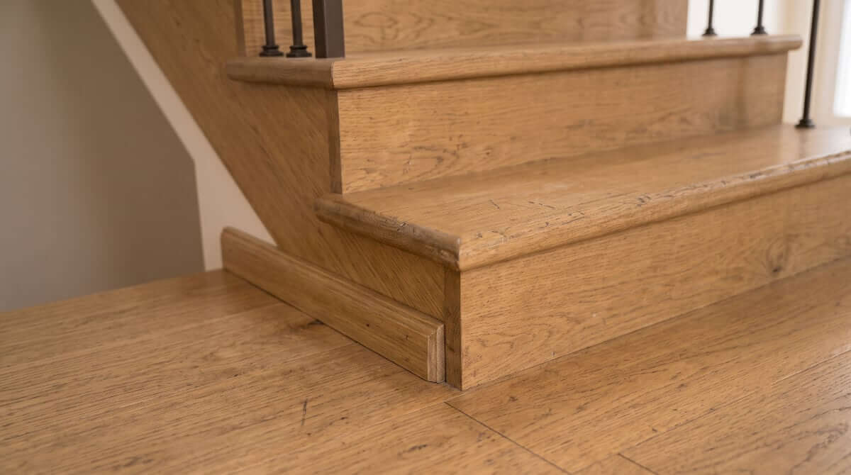 Close-up of a timber stair showing treads, edges and covering — stair topics we inspect