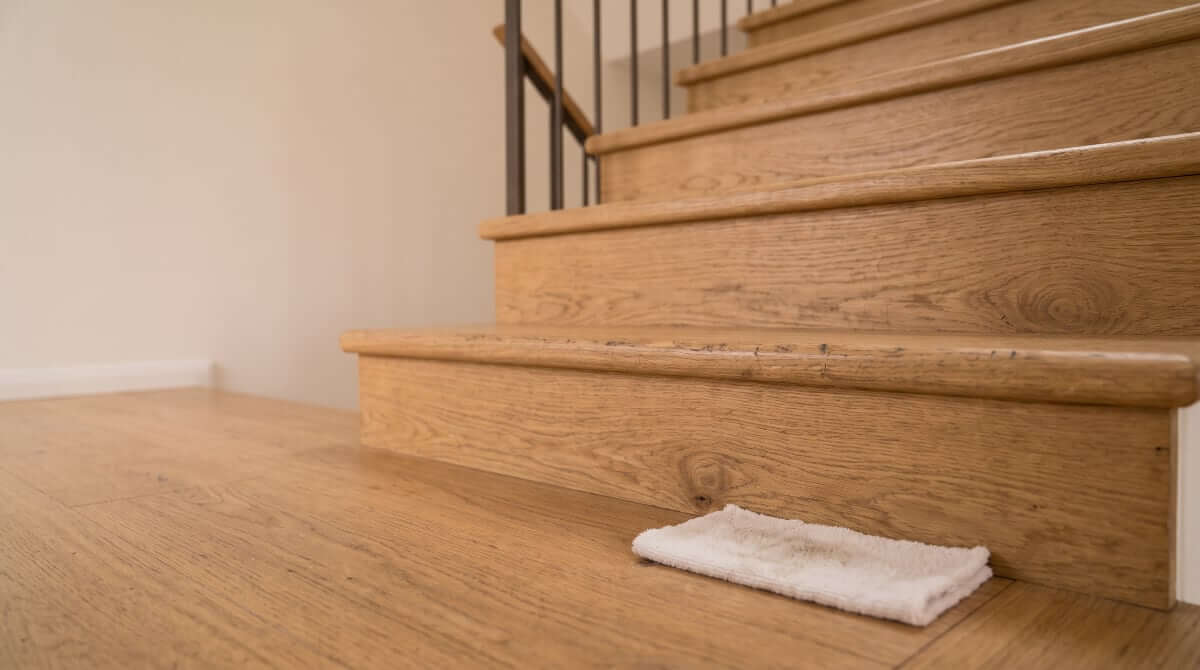 Worn oak staircase with visible wear on tread edges — when stair renovation can make sense